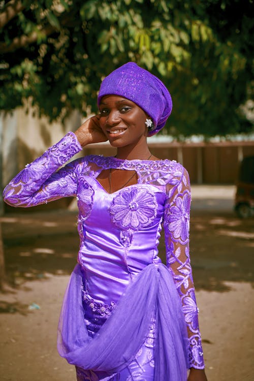 Smiling Woman in Purple Dress