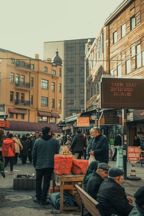 Free Bustling city marketplace with vendors and shoppers on a busy day. Urban life captured at its finest. Stock Photo