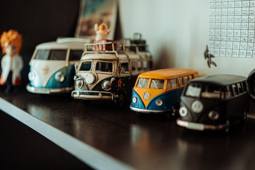 Free A collection of vintage Volkswagen toy cars displayed on a shelf. Stock Photo