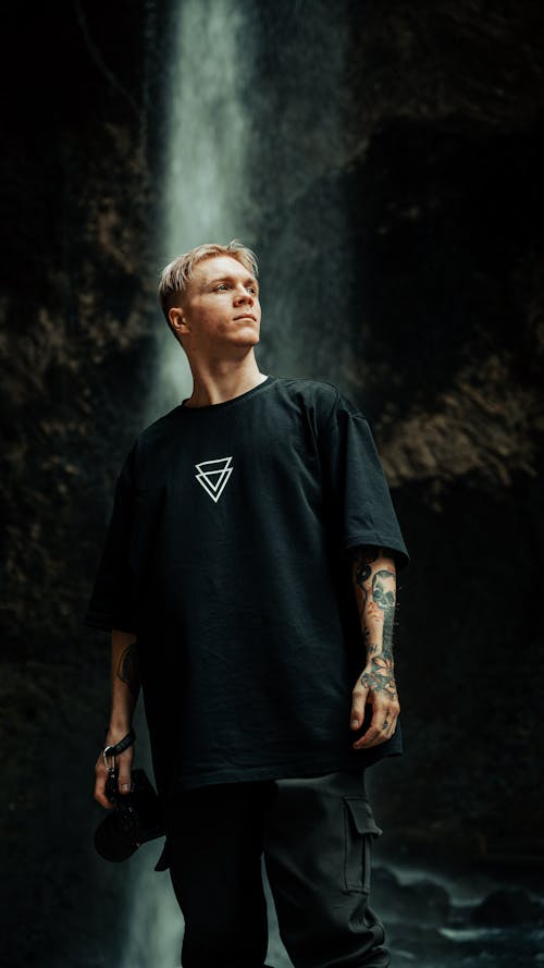 Man Posing in Black T-Shirt with White Triangles Print