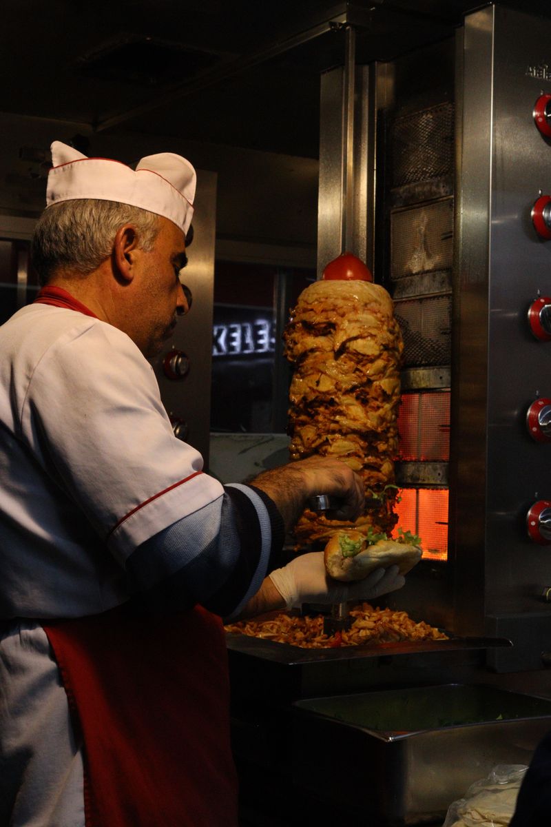 Preparing a fresh gyros wrap in the shop
