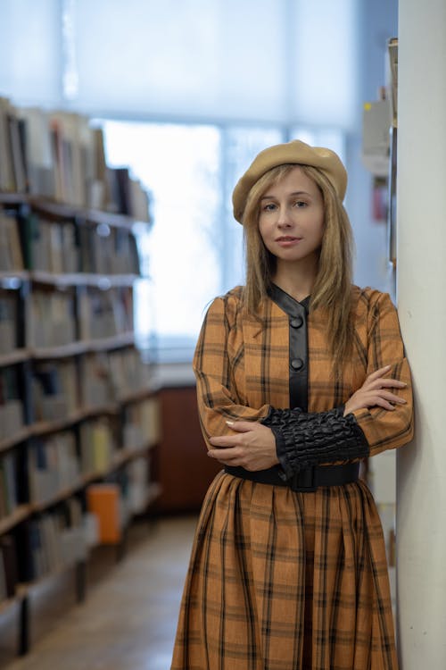 Woman in Dress and Beret at Library