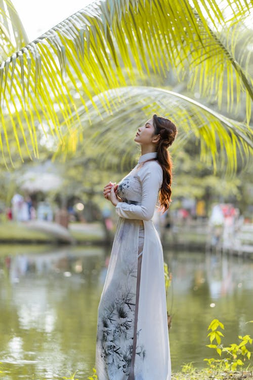 Woman Posing in a Tropical Park