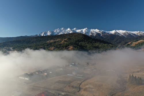 Mountain Valley Covered with Smoke 