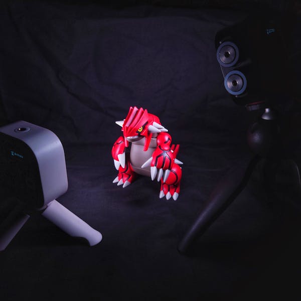 Dinosaur figurine, dramatic studio lighting, collectible toy