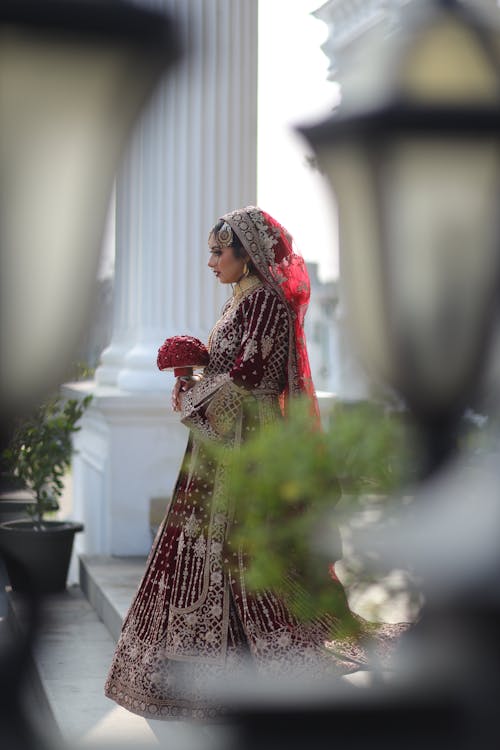 Candid Photo of a Bride in Traditional Clothes and Jewelry 
