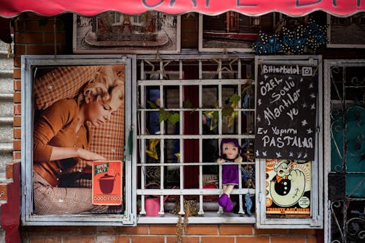 Charming urban cafe facade with barred window and vintage decorations.