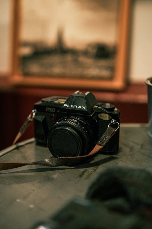 A Pentax P50 Film Camera Standing on a Table 