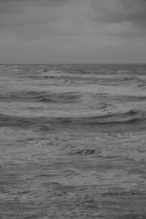 A black and white photo of the ocean