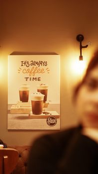 A warm, inviting coffee shop with blurred focus on decor, perfect for a cozy atmosphere.