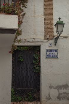 Discover the rustic beauty of Carmen de la Munequita in Granada, Spain with this charming street view.