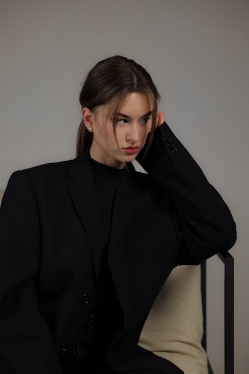 Woman Sitting in Black Clothes