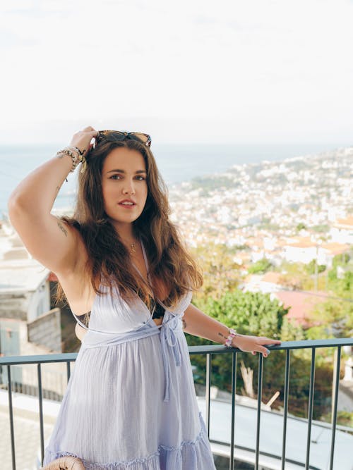 Free Portrait of a Woman on a Balcony Stock Photo