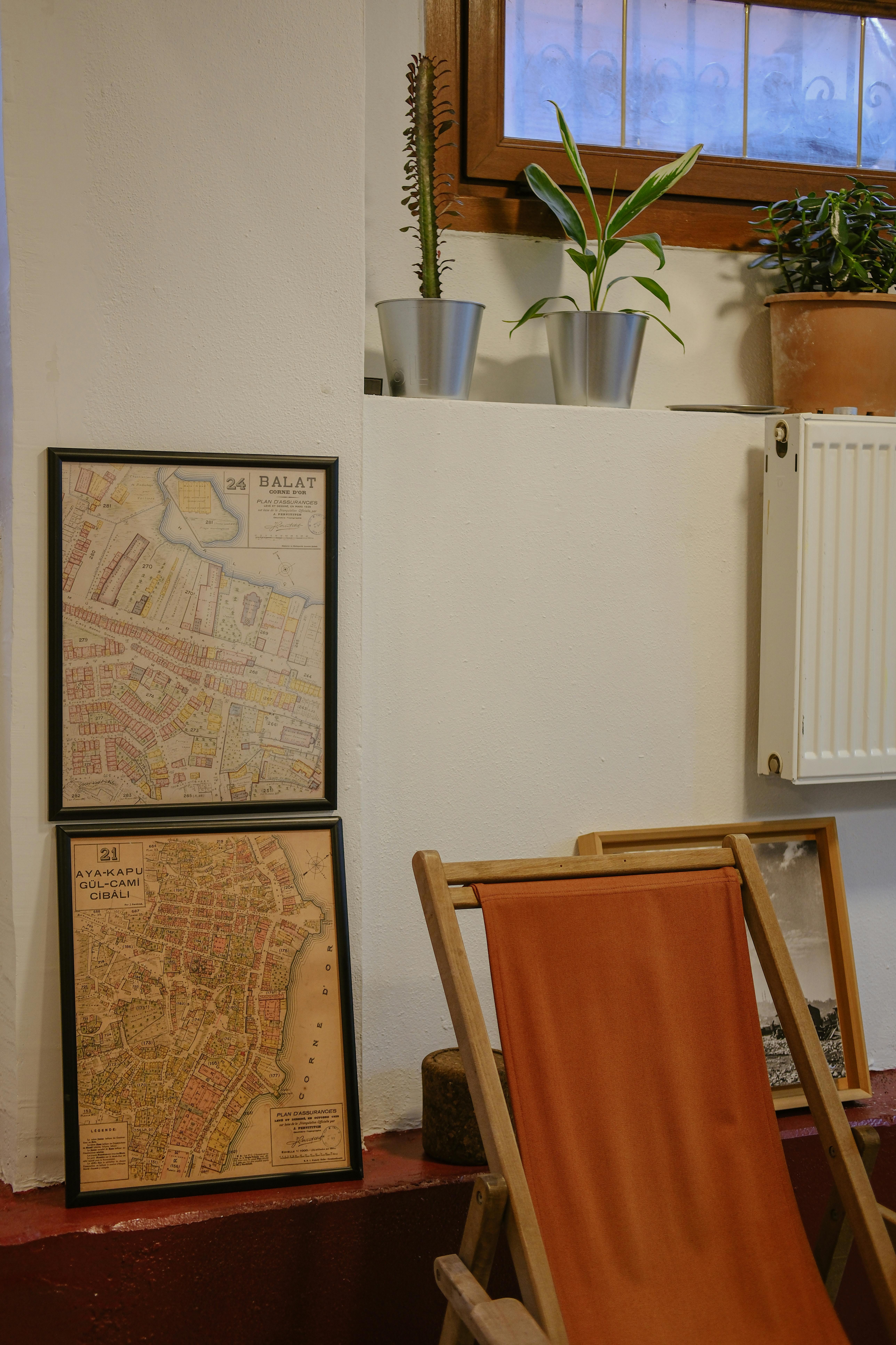 a map on the wall and a chair in front of it