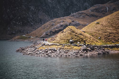 View of People Walking on a Hiking Trail in Snowdonia National Park, Wales 