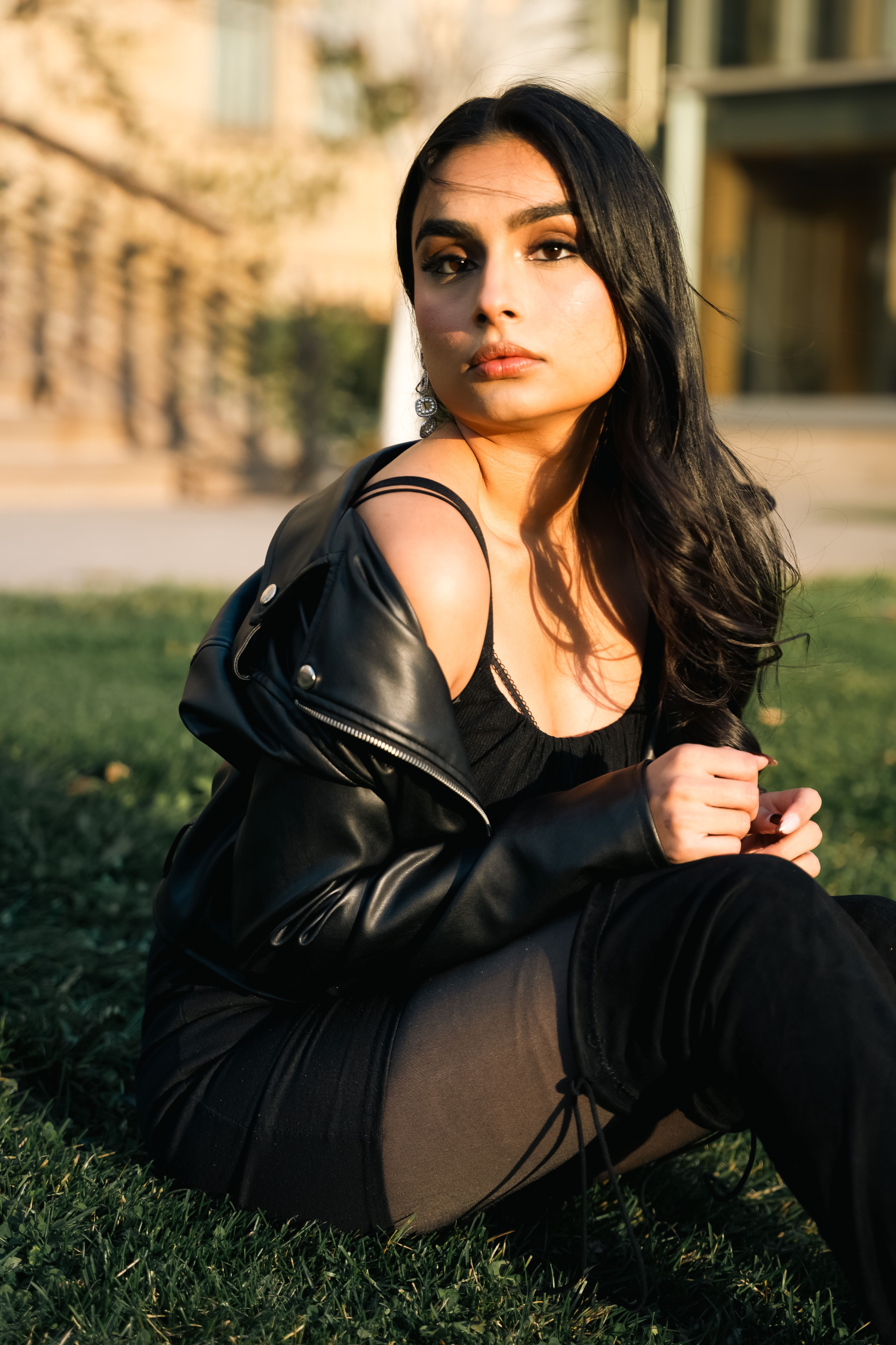 A Woman Wearing a Black Dress and Sitting on the Floor  Free Stock Photo
