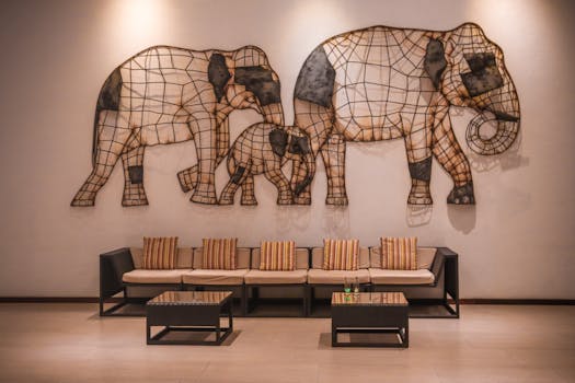Modern waiting room with elephant wall art and comfortable seating area.