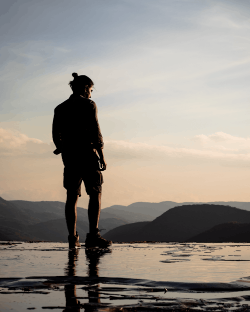 Free Man standing
on Water Stock Photo