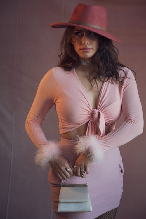 Young Woman in a Pink Dress and a Hat 