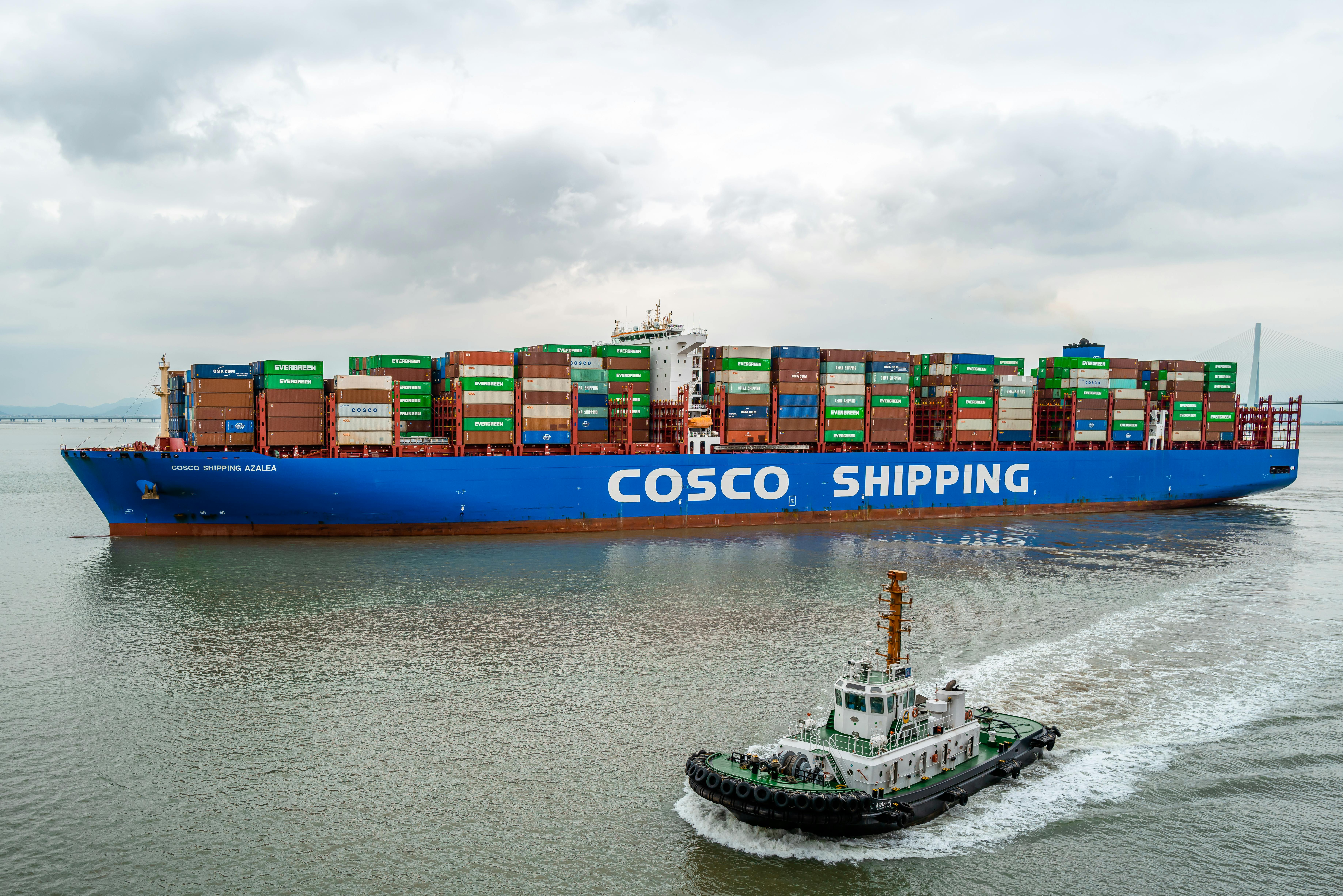 Free A large COSCO container ship navigates the waters of Ningbo Harbor, China. Stock Photo