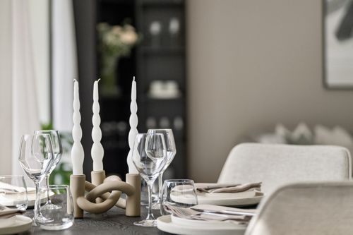 Free Chic dining room setup with twisted candles and glassware for a luxurious minimalist look. Stock Photo
