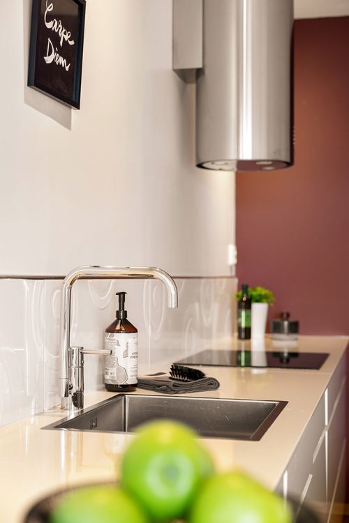 Free A sleek kitchen interior featuring a modern sink and minimalist design elements for a stylish living space. Stock Photo