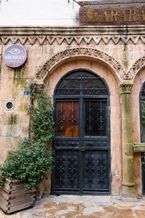 The entrance to a building with a black door