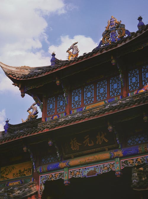 The entrance to a chinese temple with ornate architecture