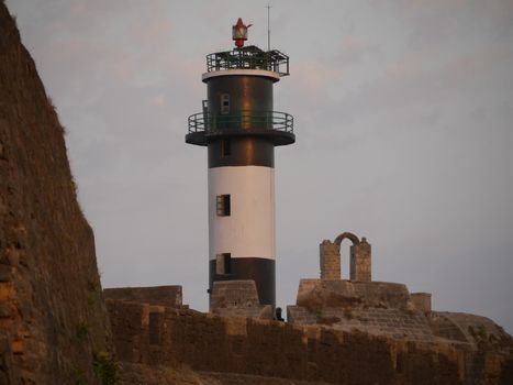 View of a traditional lighthouse within the ancient Dwarka fort in Gujarat, India.