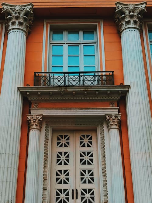 Facade of an Orange Building with Columns