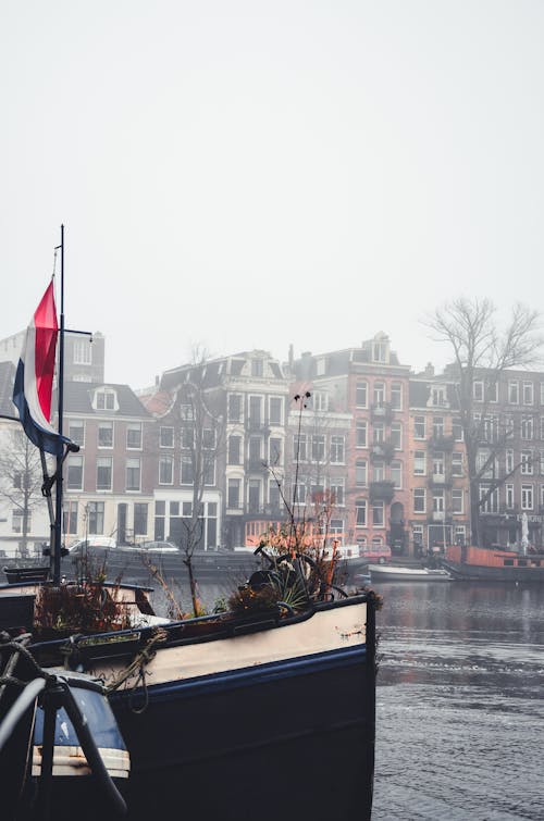 Photos gratuites de amsterdam, bâtiments, brouillard