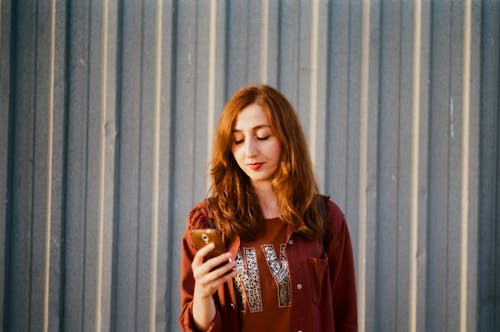 Woman Standing with Smartphone