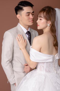 A beautiful couple in wedding attire posing elegantly, capturing a special moment in Hà Nội, Việt Nam.