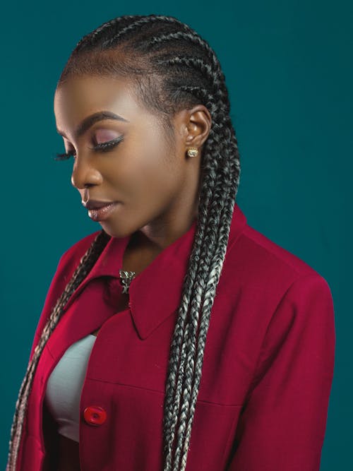 Young Black Woman with Dreadlocks in Studio