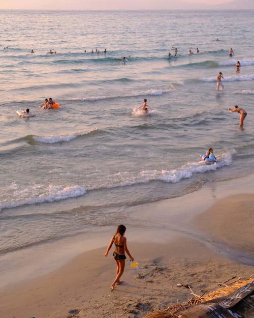 People Relaxing on Beach on Sunset