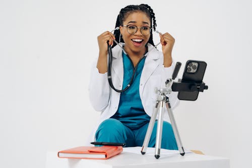 Doctor Using Stethoscope during an Online Medical Consultation 