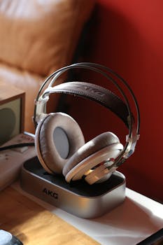 Stylish AKG K701 headphones in a modern indoor setting.