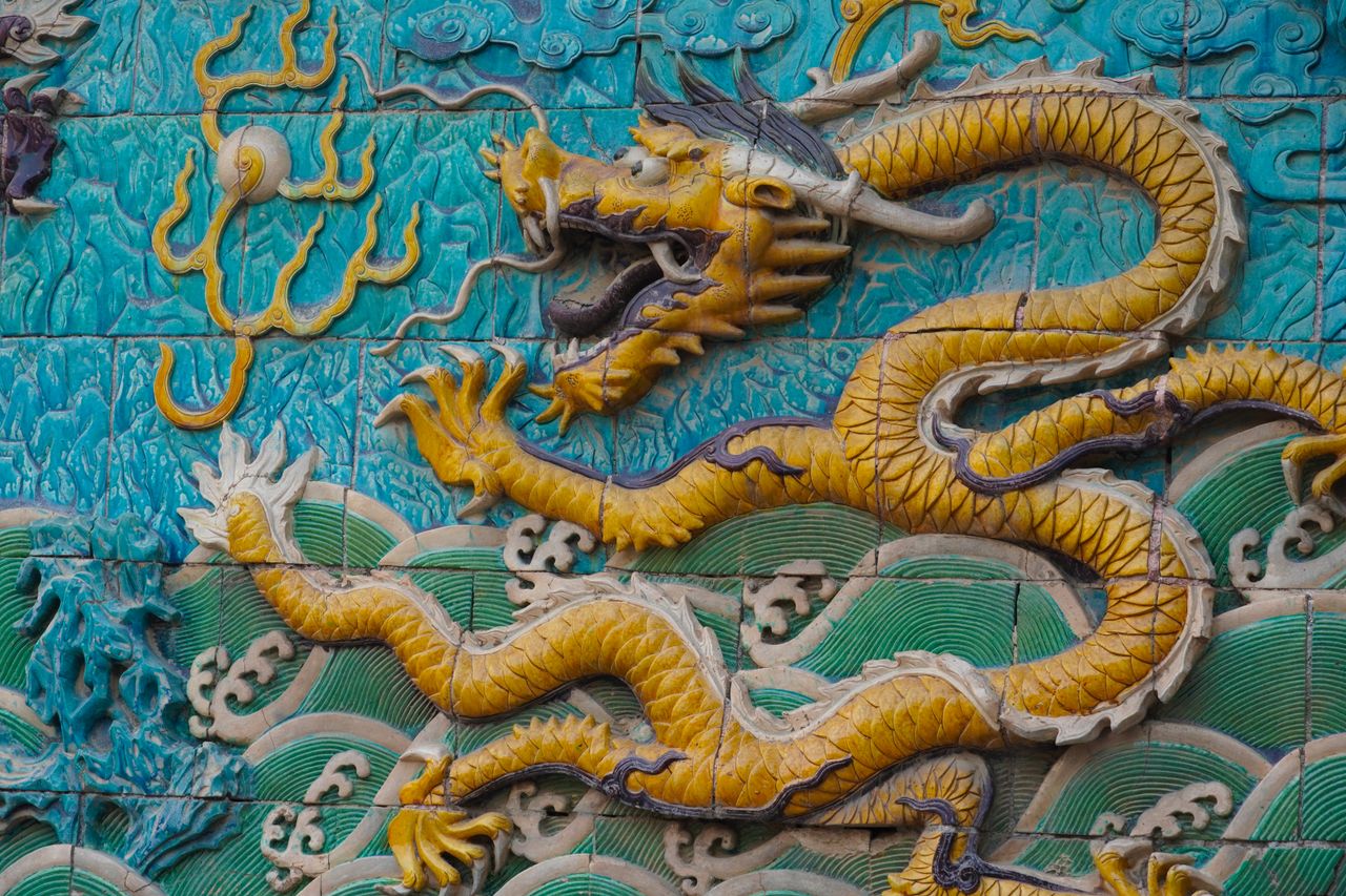 a detailed chinese dragon tile artwork featuring intricate design and