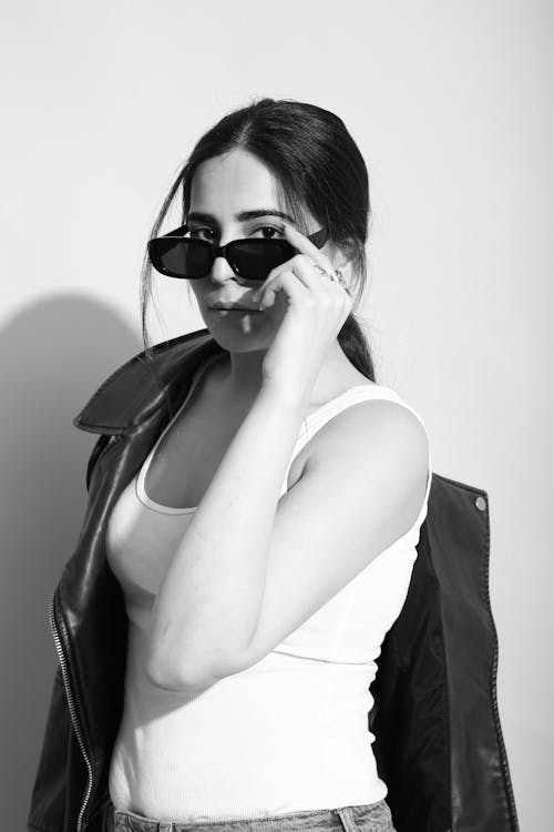 Portrait of Brunette Woman Wearing Sunglasses in Black and White 