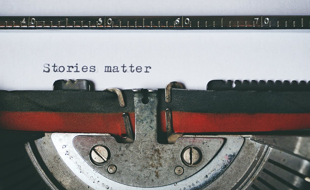 A typewriter with the words "Stories matter" printed on the page.