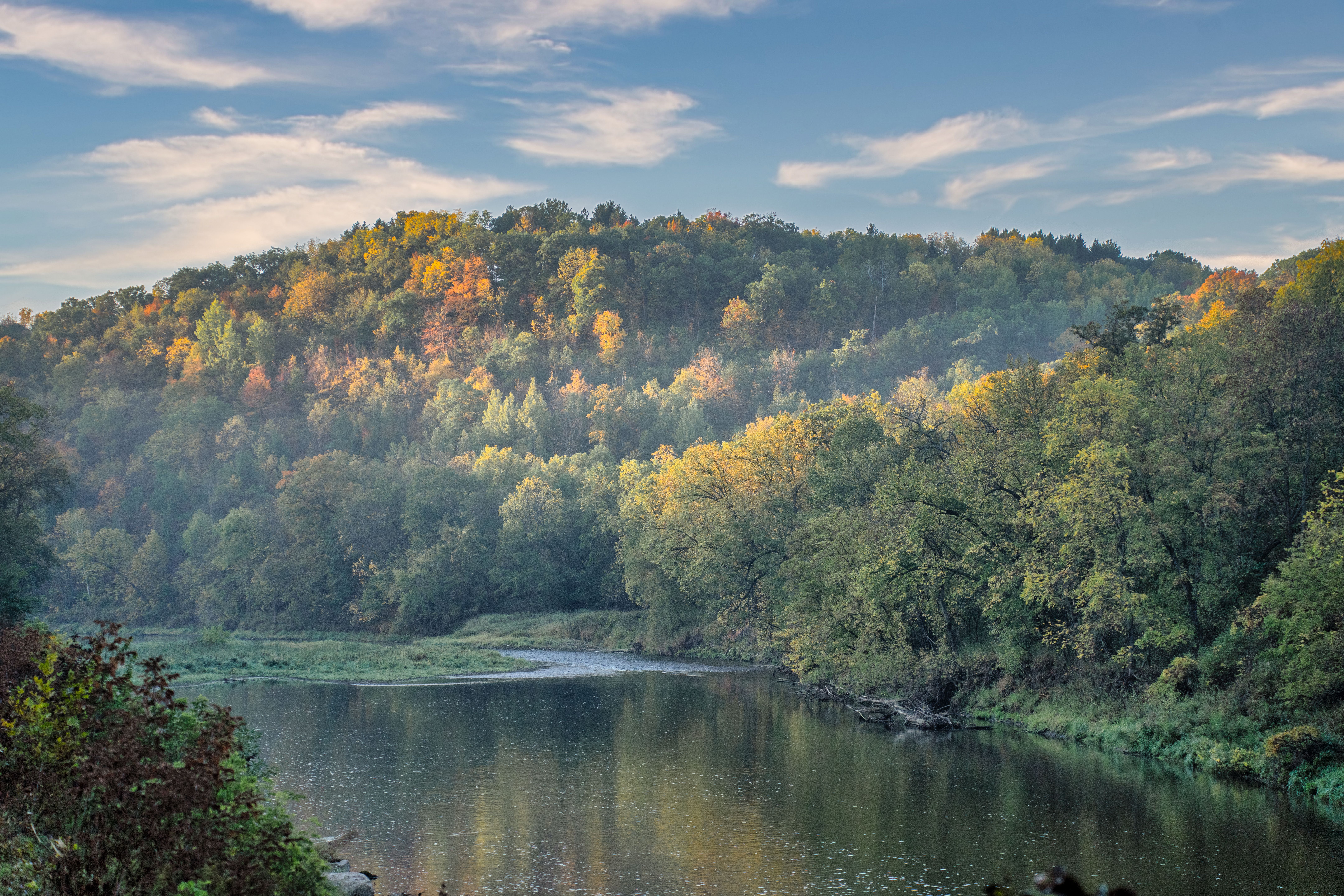 Beautiful autumn forest with mist over a river in Hammond, Minnesota.