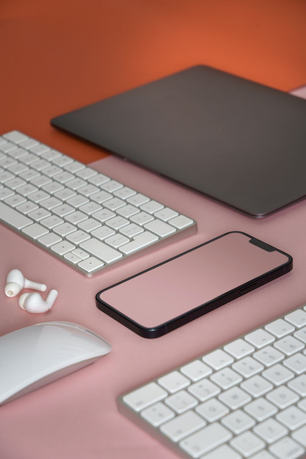 Wireless Devices on Pink Table · Free Stock Photo