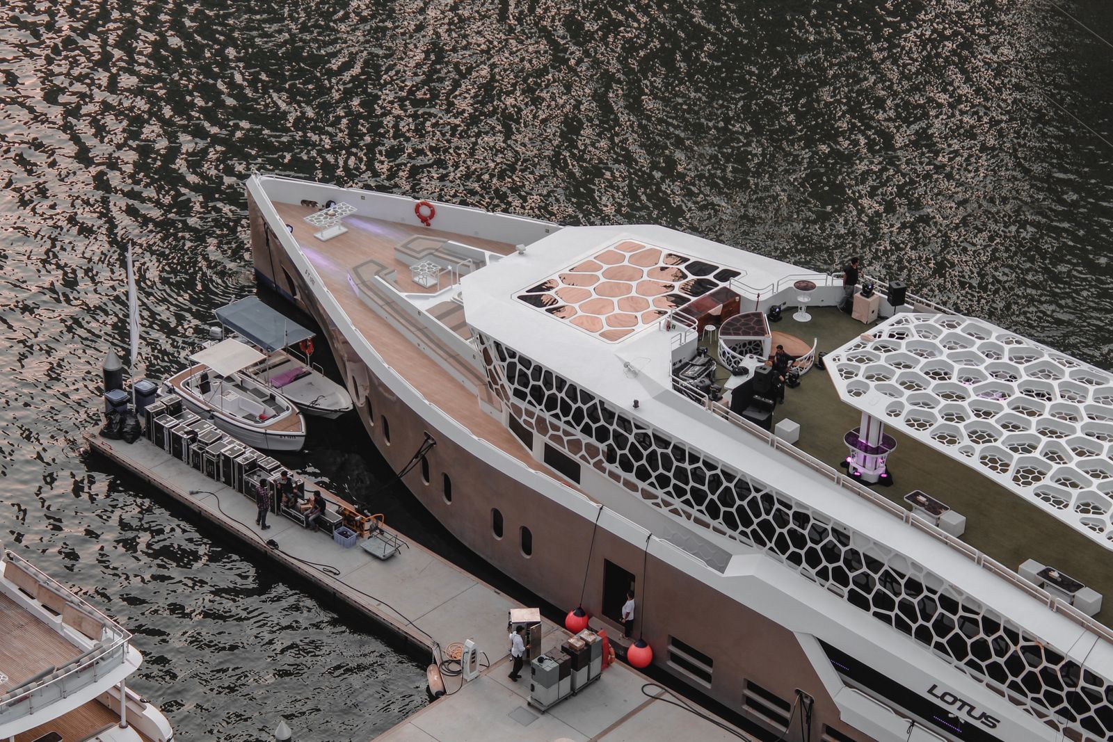 Aerial view of the Lotus mega yacht moored at a pier in Dubai Marina