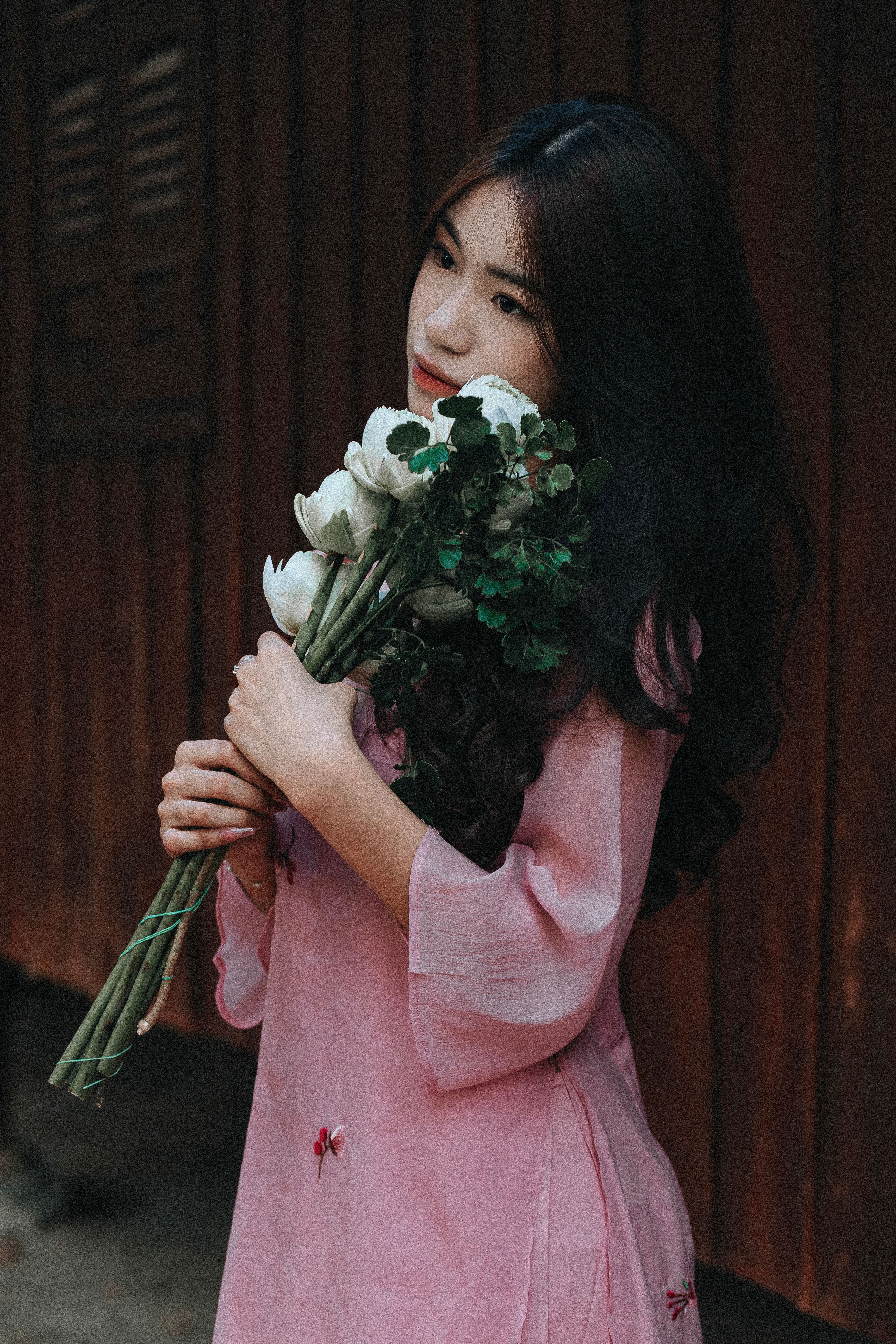 Woman in Pink Dress Holding White Flowers · Free Stock Photo