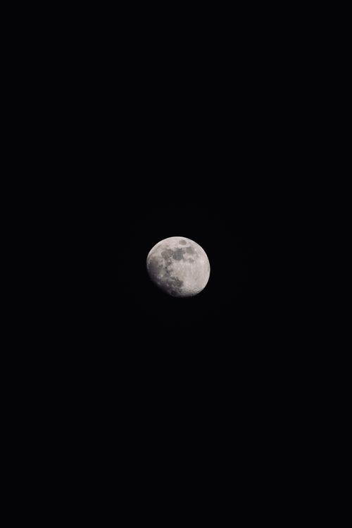 Free Stunning half moon against a dark sky, perfect for astronomy and space themes. Stock Photo