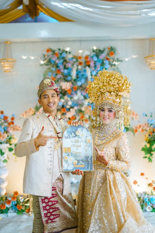 Smiling Newlyweds in Traditional Clothing