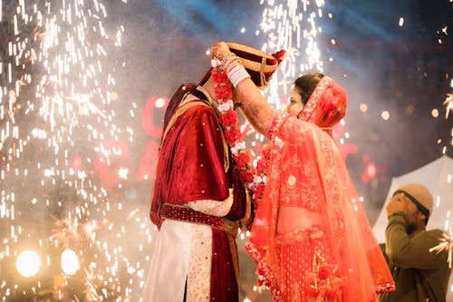 Lights over Newlyweds in Traditional Clothing