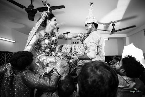 Black and White Photo of a Just Married Couple Dancing