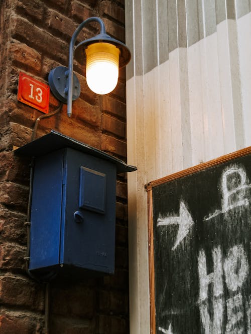 Lamp over Box on Wall