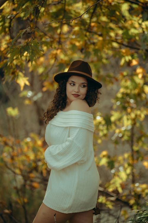 Woman in White Sweater and Hat